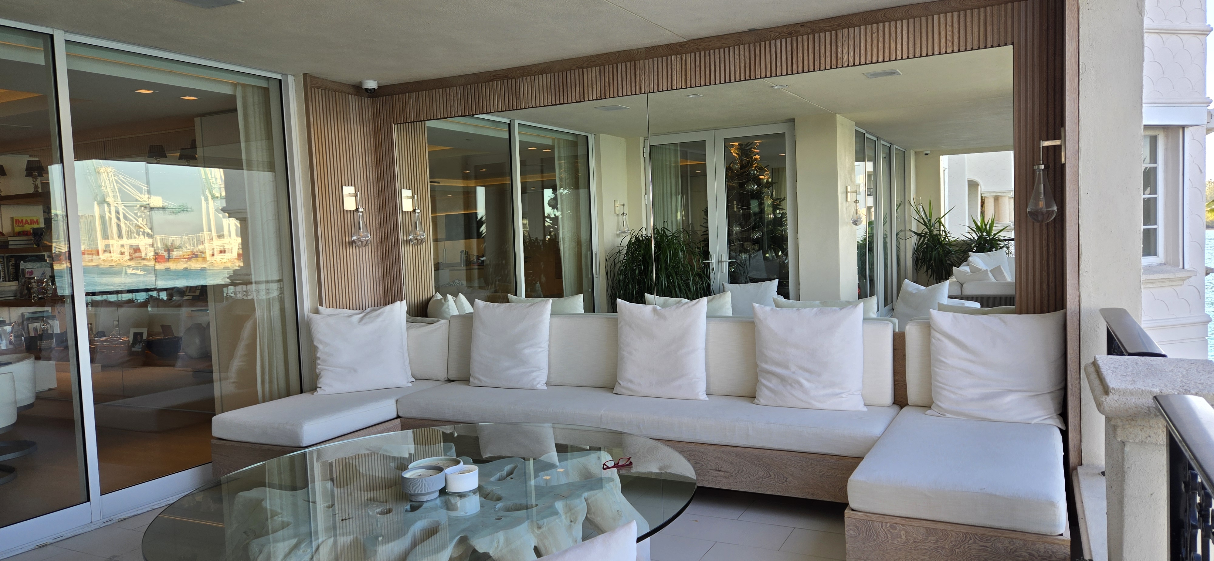 Custom wood slat accent wall with built-in seating and waterway view